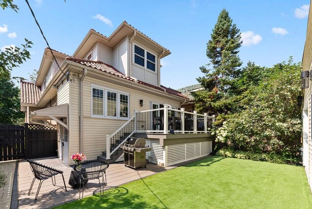 2530 W Morse Ave, Chicago, IL 60645 - rear view of property featuring a deck, stairway, and a tile roof