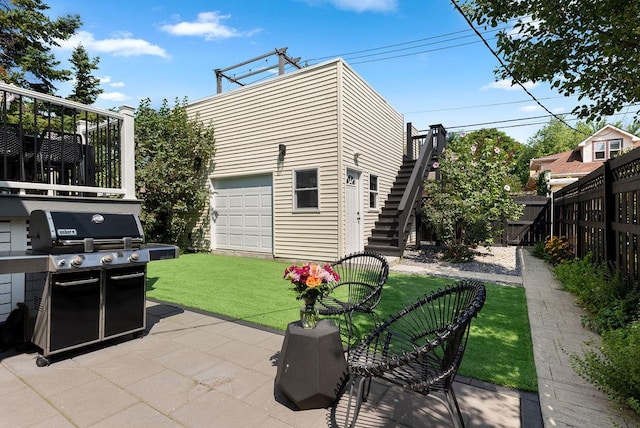 2530 W Morse Ave, Chicago, IL 60645 - fenced backyard with stairs, area for grilling, and a patio area