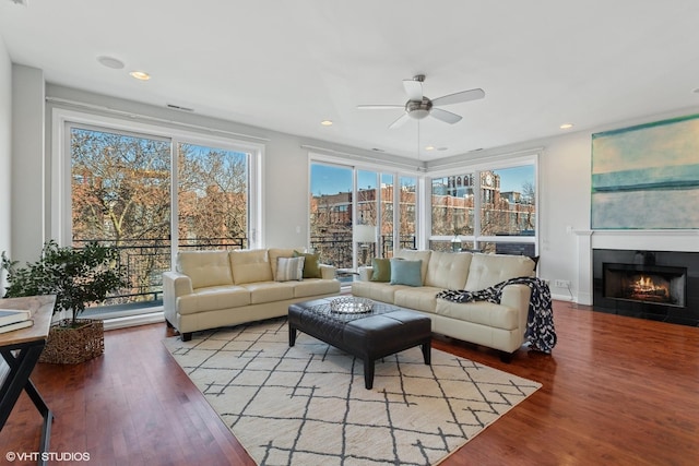 2315 W Wabansia Ave Unit 3Ne, Chicago, IL 60647 - living room featuring a ceiling fan, wood finished floors, a fireplace with flush hearth, and recessed lighting