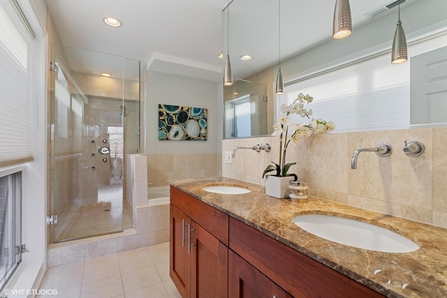 2315 W Wabansia Ave Unit 3Ne, Chicago, IL 60647 - bathroom featuring tile patterned flooring, a shower stall, a garden tub, double vanity, and recessed lighting