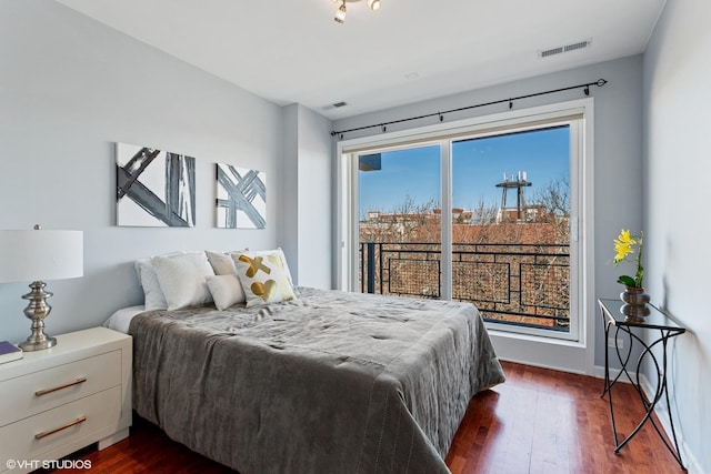 2315 W Wabansia Ave Unit 3Ne, Chicago, IL 60647 - bedroom with dark wood-style flooring and access to exterior