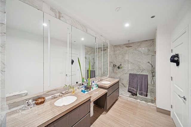 363 E Wacker Dr Unit 1602, Chicago, IL 60601 - bathroom featuring a marble finish shower, vanity, and recessed lighting