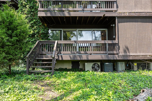 5515 Lakeside Dr Unit 1D, Lisle, IL 60532 - rear view of property featuring central AC, stairway, and a deck