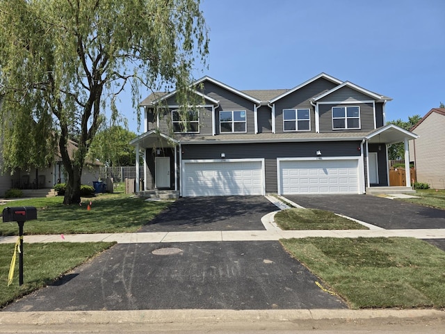 1390 Merrimac Ln, Hanover Park, IL 60133 - view of front facade featuring driveway, an attached garage, and a front lawn