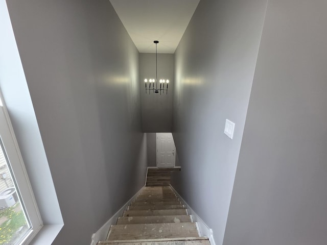 1390 Merrimac Ln, Hanover Park, IL 60133 - stairway with a chandelier and wood finished floors