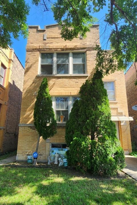 5330 W Foster Ave, Chicago, IL 60630 - view of front of home with brick siding and a front yard