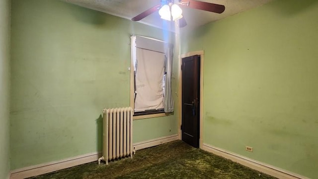 5330 W Foster Ave, Chicago, IL 60630 - empty room featuring radiator and a ceiling fan