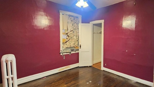 5330 W Foster Ave, Chicago, IL 60630 - empty room with radiator, wood finished floors, and a ceiling fan