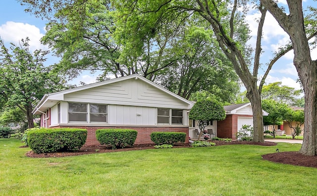 6231 W 127th Pl, Palos Heights, IL 60463 - view of front of property featuring brick siding, a front lawn, and an attached garage
