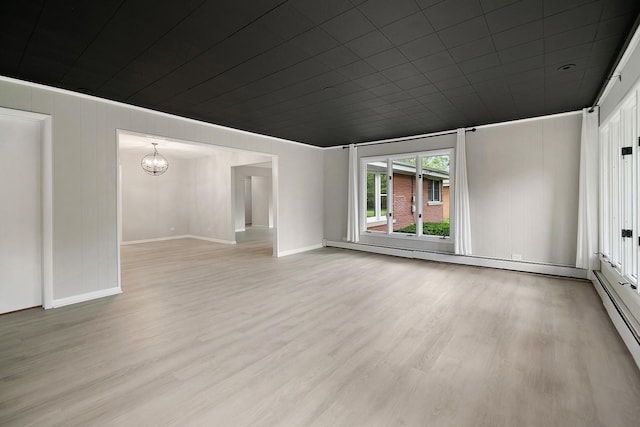 6231 W 127th Pl, Palos Heights, IL 60463 - spare room with baseboard heating, light wood-style floors, and a chandelier