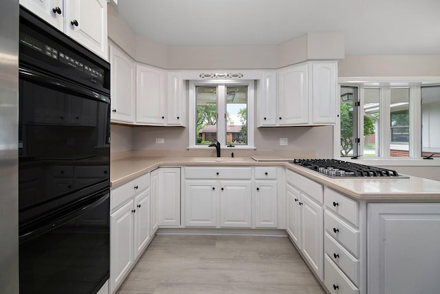 6231 W 127th Pl, Palos Heights, IL 60463 - kitchen with stainless steel gas cooktop, light countertops, and white cabinets