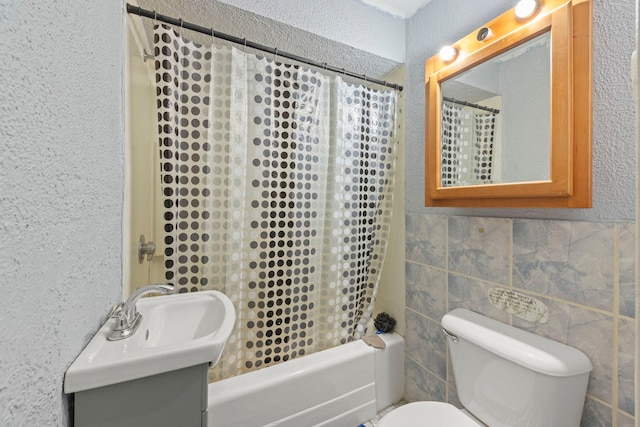 1207 Oakland Ave, Joliet, IL 60435 - bathroom with shower / bathtub combination with curtain, vanity, a textured wall, and tile walls