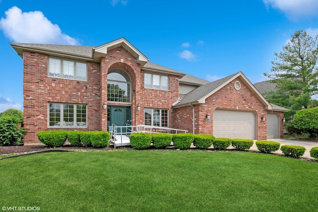 17935 Pheasant Lake Dr, Tinley Park, IL 60487 - traditional-style home featuring brick siding, an attached garage, a front lawn, driveway, and a shingled roof