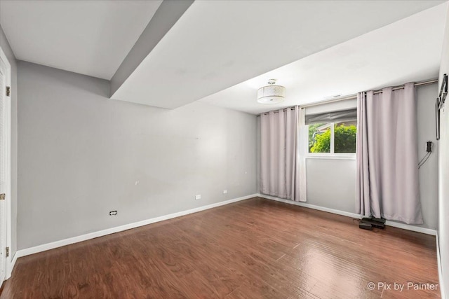 611 Brewster Ln, Schaumburg, IL 60193 - empty room with baseboards and wood finished floors