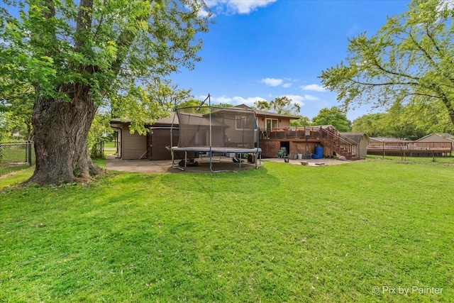 611 Brewster Ln, Schaumburg, IL 60193 - view of yard with a trampoline, a wooden deck, and stairway