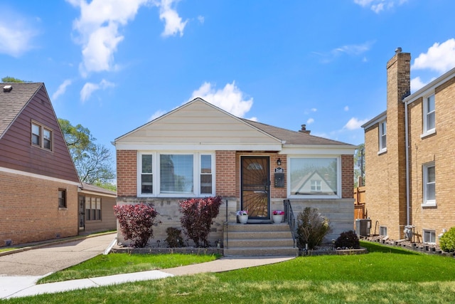 1546 N Lee Blvd, Berkeley, IL 60163 - bungalow-style house featuring brick siding, a front lawn, and cooling unit