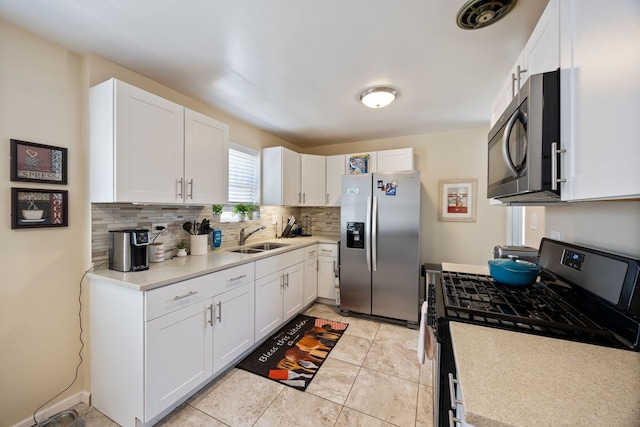 1546 N Lee Blvd, Berkeley, IL 60163 - kitchen with stainless steel appliances, a sink, backsplash, and light countertops
