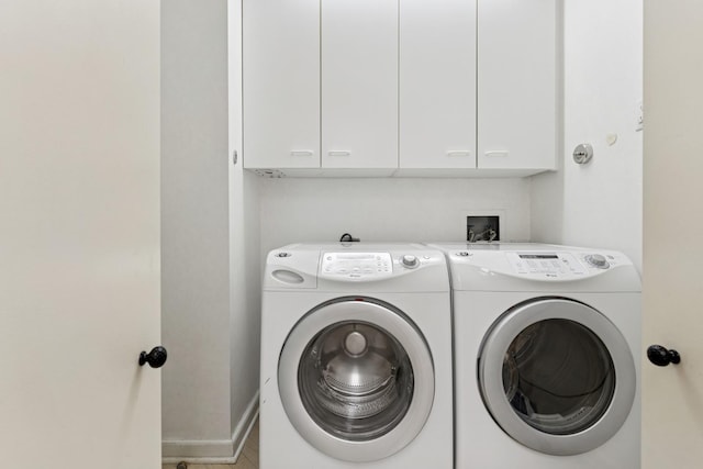 132 E Delaware Pl Unit 5504, Chicago, IL 60611 - laundry room featuring washer and dryer, cabinet space, and baseboards