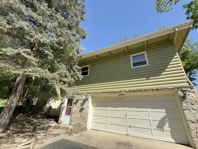 27616 W Rowe Ave, Spring Grove, IL 60081 - view of front of house featuring stone siding and a garage