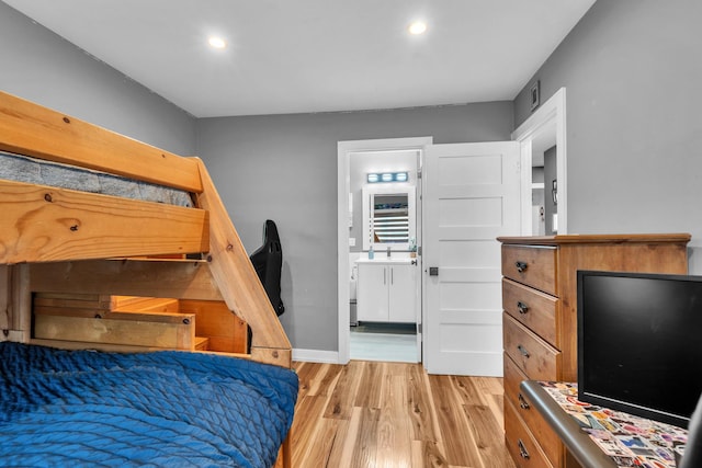 86611/2 W Foster Ave Unit 3A, Chicago, IL 60656 - bedroom with light wood-style flooring, recessed lighting, baseboards, and ensuite bath