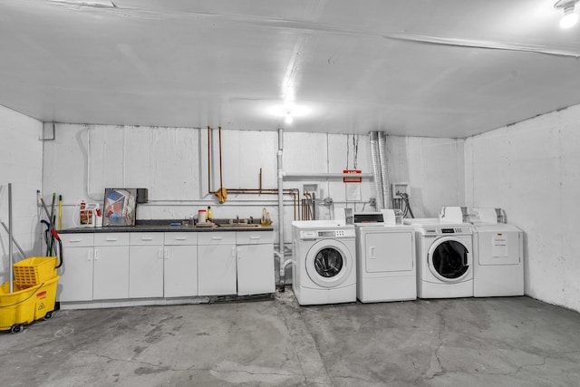 86611/2 W Foster Ave Unit 3A, Chicago, IL 60656 - laundry area featuring washer and dryer and cabinet space