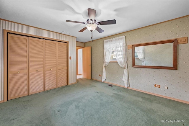 1434 Somerset Ln, Schaumburg, IL 60193 - unfurnished bedroom featuring carpet floors, a closet, wallpapered walls, ornamental molding, and ceiling fan