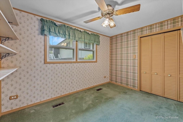 1434 Somerset Ln, Schaumburg, IL 60193 - unfurnished bedroom with a closet, carpet floors, crown molding, and ceiling fan