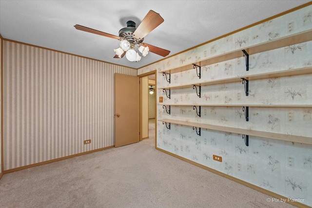 1434 Somerset Ln, Schaumburg, IL 60193 - carpeted empty room featuring wallpapered walls, a ceiling fan, and ornamental molding