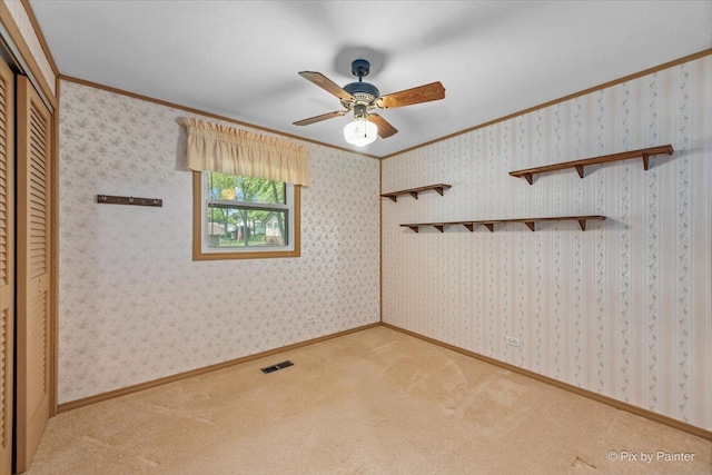 1434 Somerset Ln, Schaumburg, IL 60193 - carpeted empty room with ornamental molding and ceiling fan