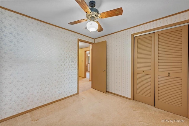 1434 Somerset Ln, Schaumburg, IL 60193 - unfurnished bedroom with ornamental molding, carpet, a closet, ceiling fan, and wallpapered walls