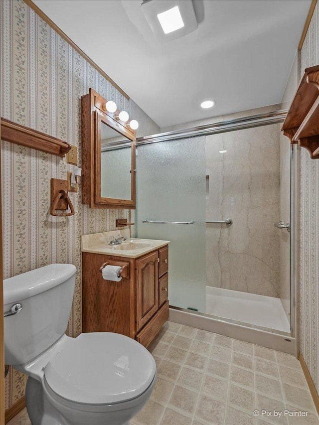 1434 Somerset Ln, Schaumburg, IL 60193 - bathroom with wallpapered walls, toilet, vanity, and a shower stall