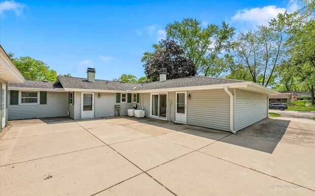 1434 Somerset Ln, Schaumburg, IL 60193 - back of property featuring a patio area and a chimney