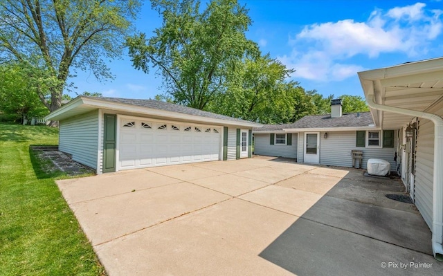 1434 Somerset Ln, Schaumburg, IL 60193 - view of front of property featuring an outbuilding, a front yard, a garage, and a chimney