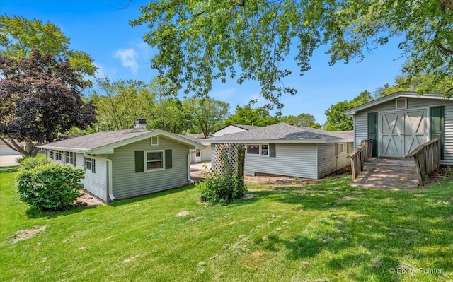 1434 Somerset Ln, Schaumburg, IL 60193 - back of house with a lawn and a chimney