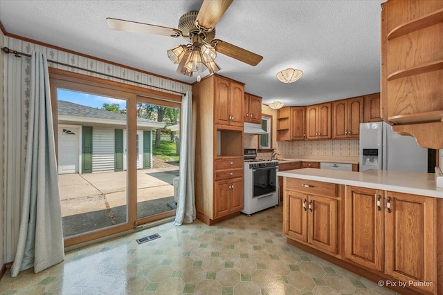 1434 Somerset Ln, Schaumburg, IL 60193 - kitchen featuring white appliances, open shelves, brown cabinets, light countertops, and under cabinet range hood