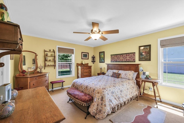 206 Wilsey Ln, Sidney, IL 61877 - carpeted bedroom featuring multiple windows, ornamental molding, and ceiling fan