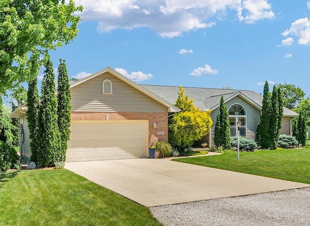 206 Wilsey Ln, Sidney, IL 61877 - ranch-style house featuring driveway, brick siding, a front yard, and an attached garage