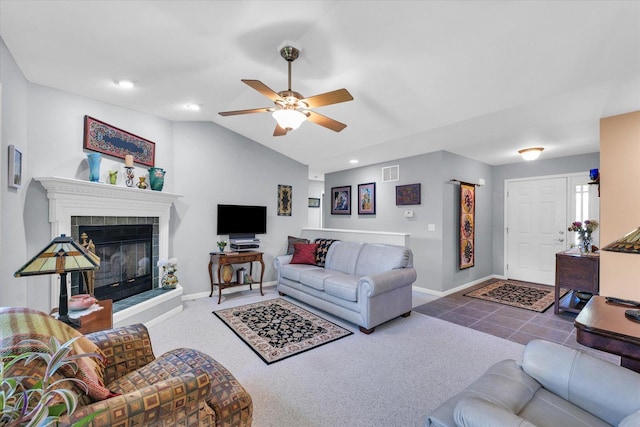206 Wilsey Ln, Sidney, IL 61877 - living area featuring ceiling fan, lofted ceiling, carpet floors, a tiled fireplace, and recessed lighting