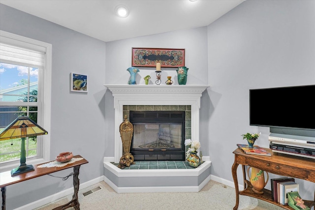 206 Wilsey Ln, Sidney, IL 61877 - living area featuring a tile fireplace and vaulted ceiling