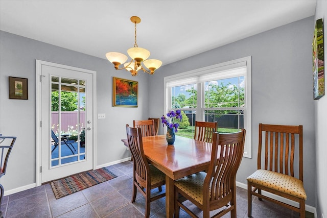 206 Wilsey Ln, Sidney, IL 61877 - dining space featuring a chandelier and baseboards