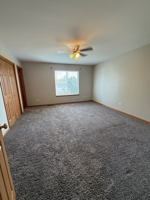 916 Bluegrass Ln, Plano, IL 60545 - unfurnished bedroom with carpet flooring, baseboards, and a ceiling fan