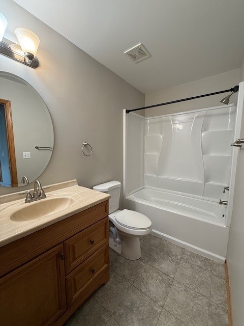 916 Bluegrass Ln, Plano, IL 60545 - bathroom with vanity, bathtub / shower combination, toilet, and tile patterned flooring