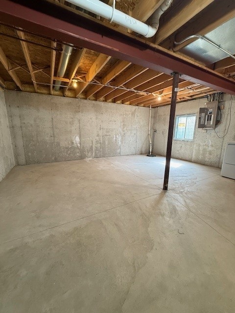 916 Bluegrass Ln, Plano, IL 60545 - below grade area featuring washer / dryer and electric panel