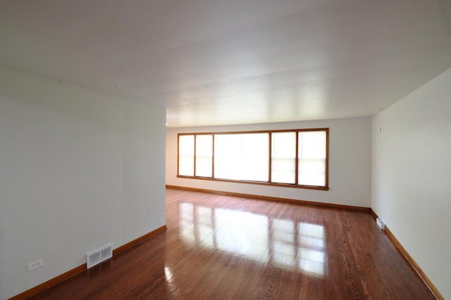 10945 S Lowe Ave, Chicago, IL 60628 - empty room featuring baseboards and wood finished floors