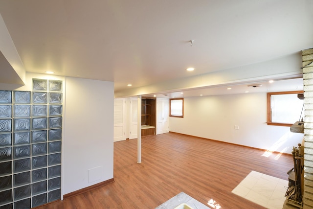 10945 S Lowe Ave, Chicago, IL 60628 - below grade area featuring wood finished floors, baseboards, and recessed lighting