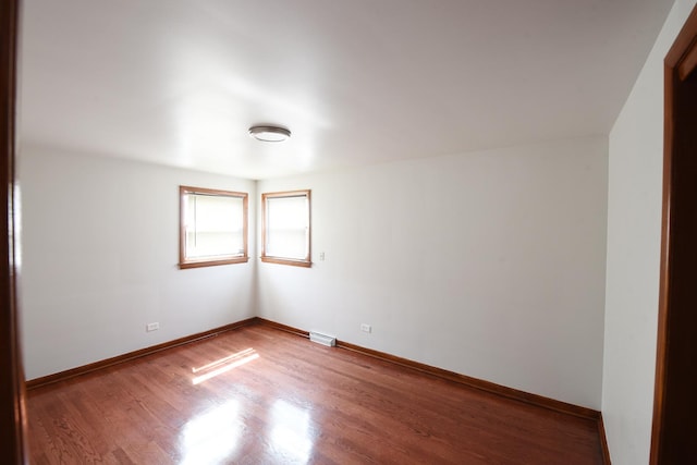 10945 S Lowe Ave, Chicago, IL 60628 - empty room with wood finished floors and baseboards