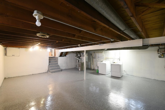 10945 S Lowe Ave, Chicago, IL 60628 - below grade area with washing machine and clothes dryer, stairs, gas meter, and heating unit
