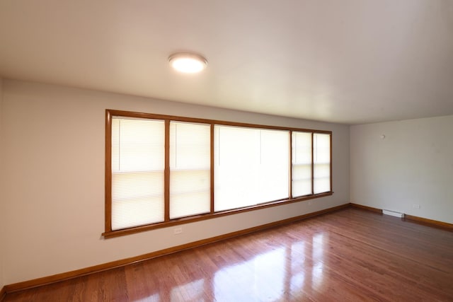 10945 S Lowe Ave, Chicago, IL 60628 - empty room with baseboards and wood finished floors