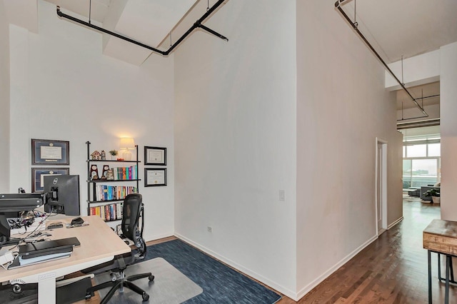 1645 W Ogden Ave Unit 722, Chicago, IL 60612 - office space featuring a towering ceiling, dark wood finished floors, and baseboards