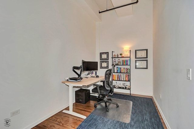 1645 W Ogden Ave Unit 722, Chicago, IL 60612 - office area featuring a high ceiling, wood finished floors, and baseboards